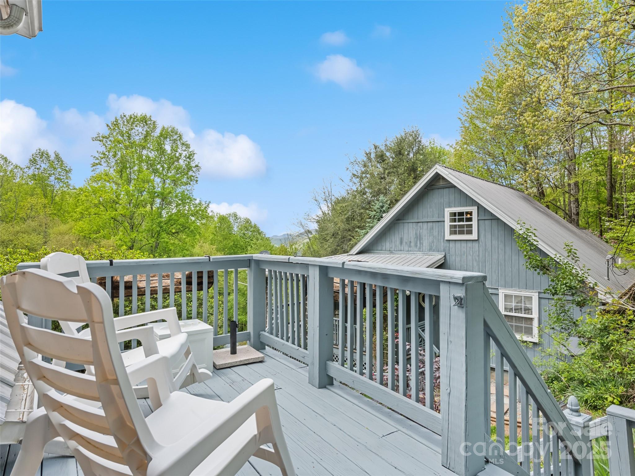 195 Three Springs Drive Sylva, NC 28779 - Photo 42 of 48 a balcony with wooden floor and fence