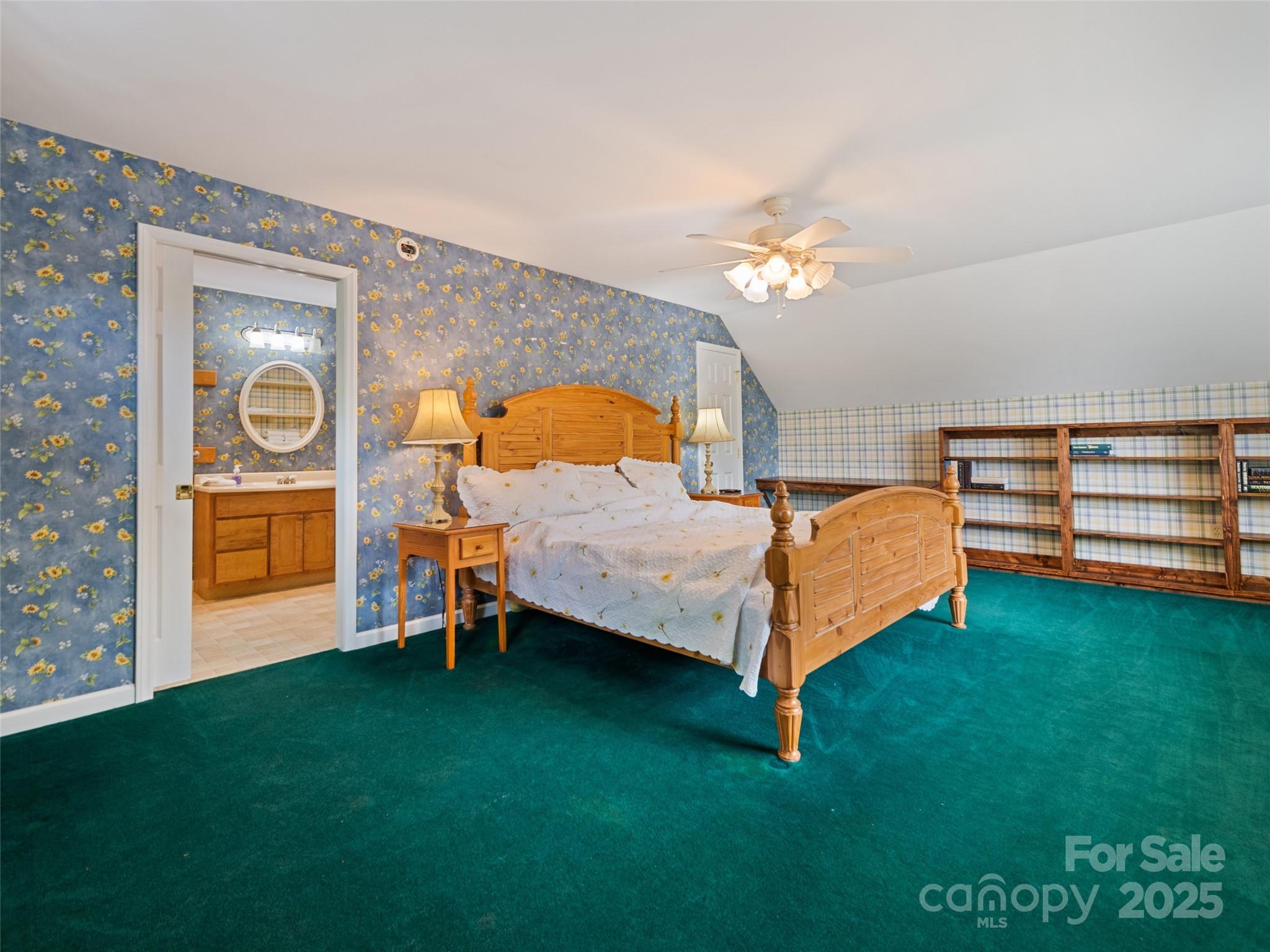 195 Three Springs Drive Sylva, NC 28779 - Photo 43 of 48 a bed room with a bed and a window