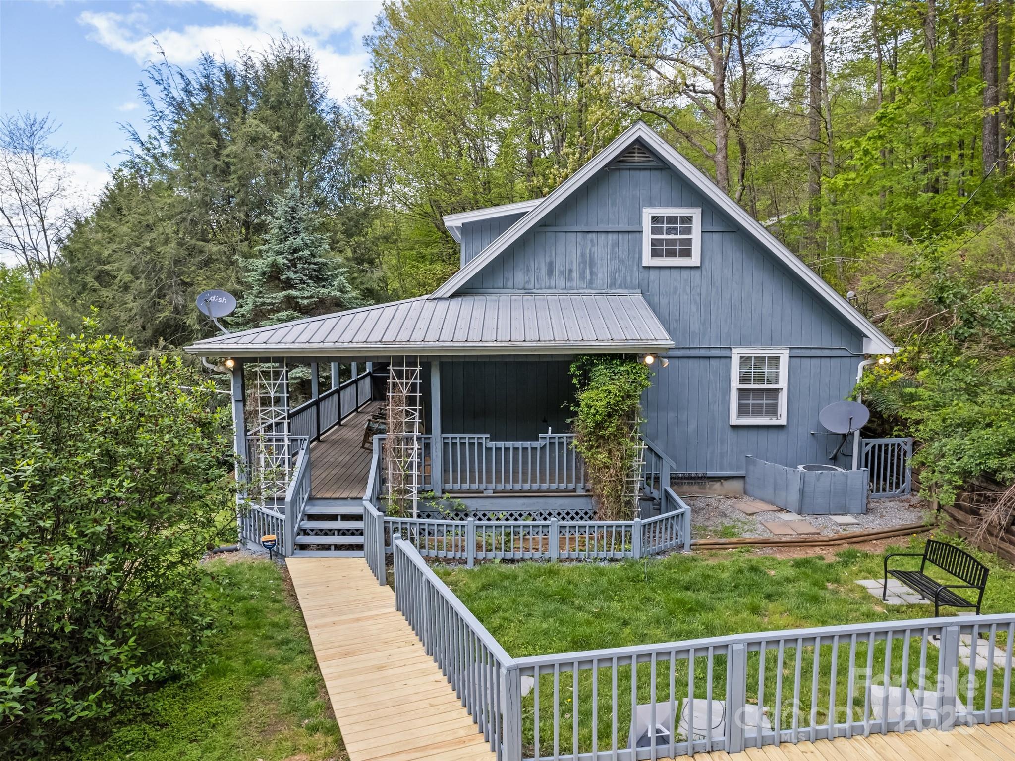 195 Three Springs Drive Sylva, NC 28779 - Photo 5 of 48 a front view of house with yard and green space