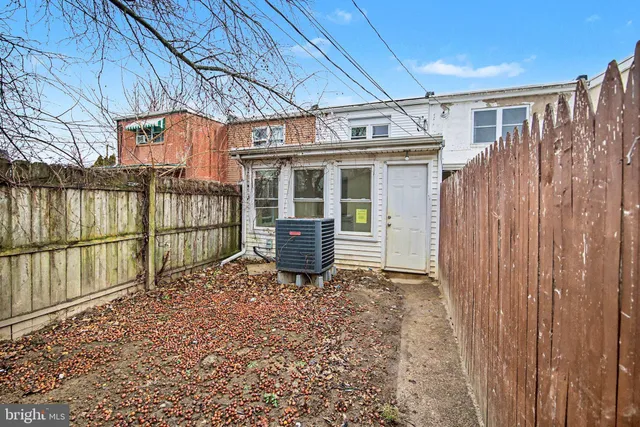 a view of a porch with wooden floor and fence