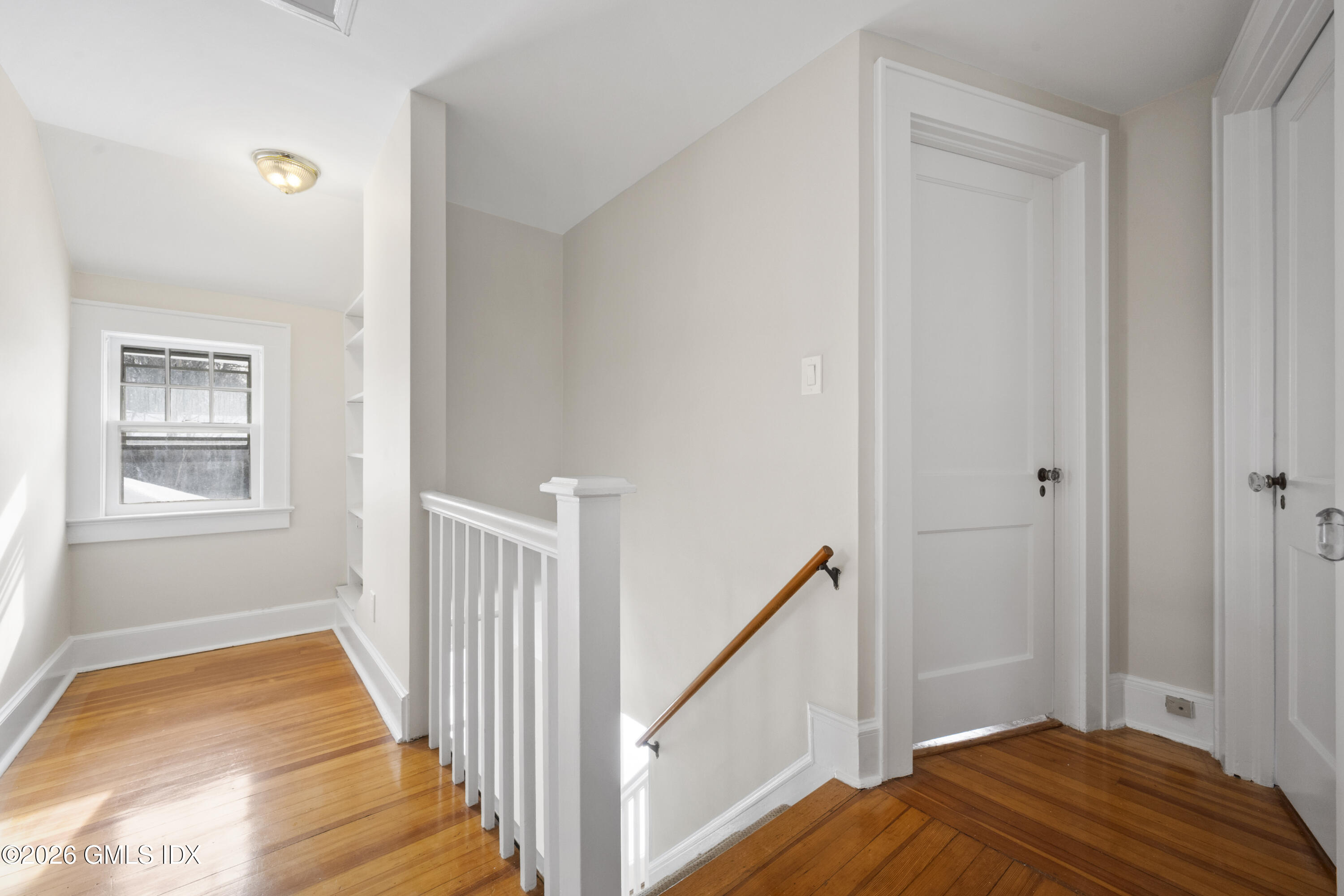 10 Anthony Place Riverside, CT 06878 - Photo 15 of 24 a view of a bedroom with wooden floor and staircase