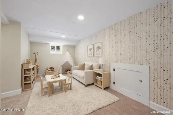 a living room with furniture and a window