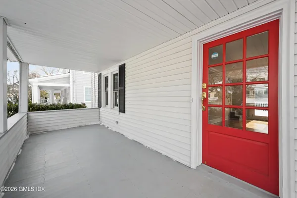 a view of an empty room and a window