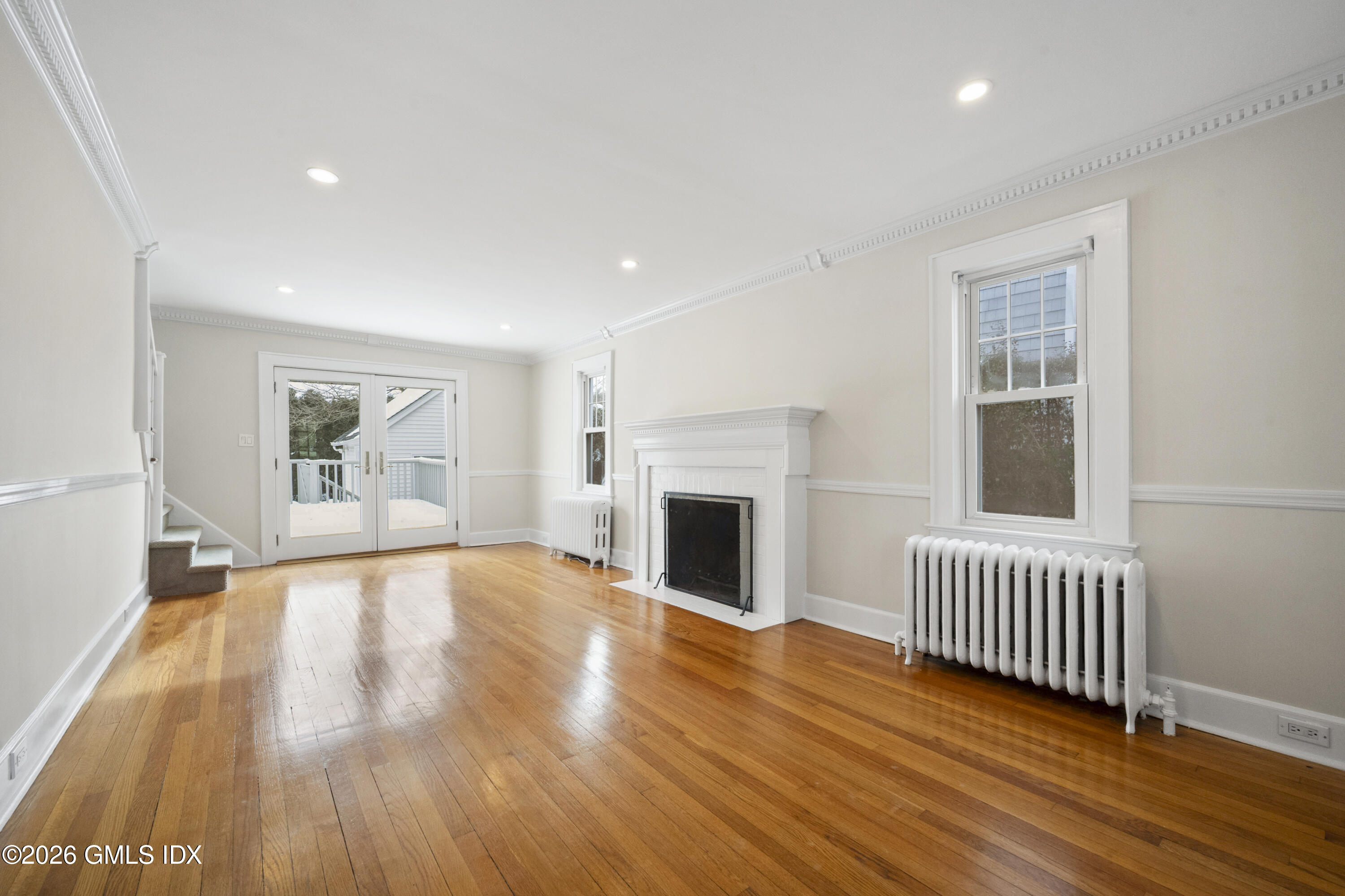 10 Anthony Place Riverside, CT 06878 - Photo 5 of 24 a view of an empty room with wooden floor and a window