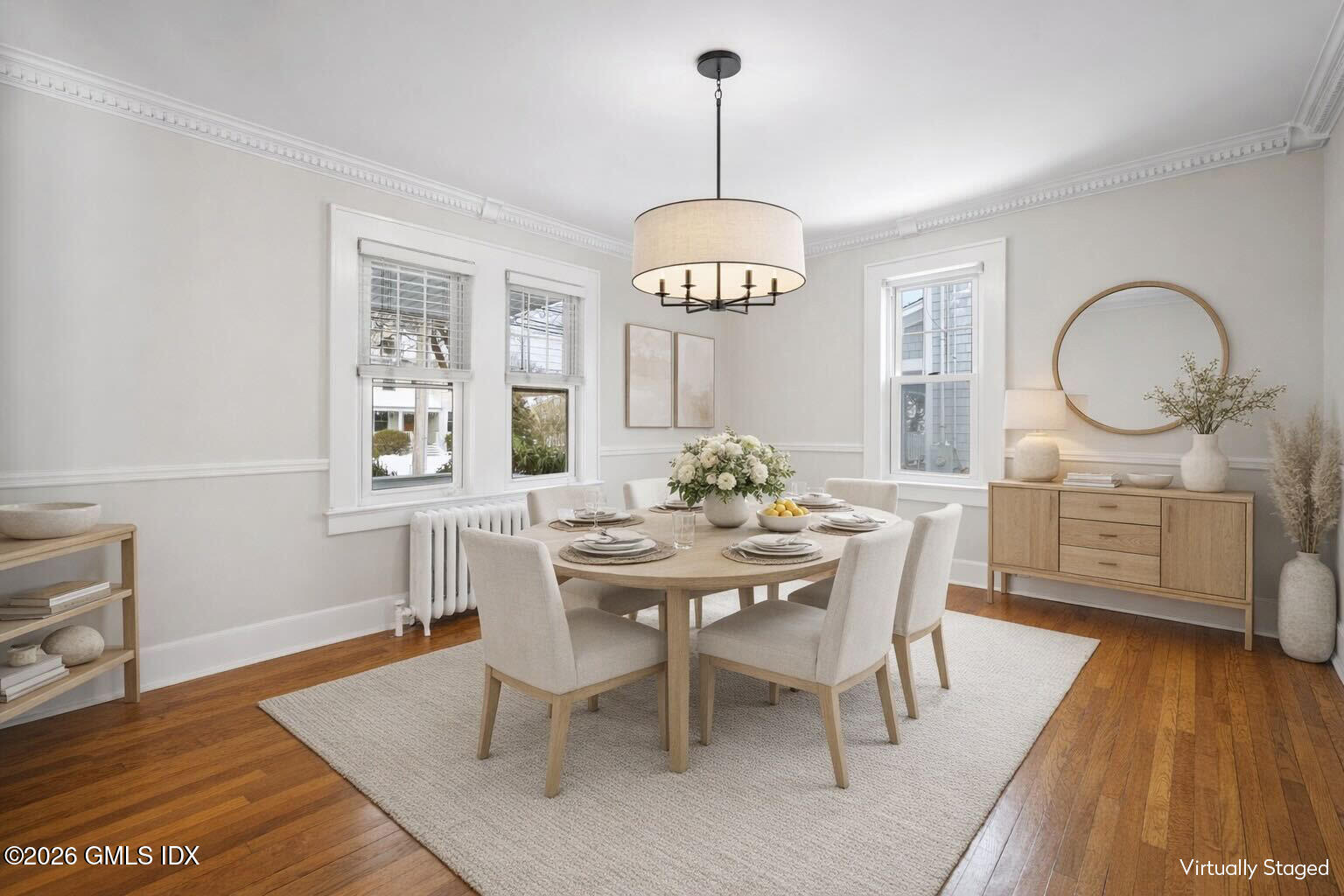 10 Anthony Place Riverside, CT 06878 - Photo 6 of 24 a dining room with wooden floor a chandelier a wooden table and chairs