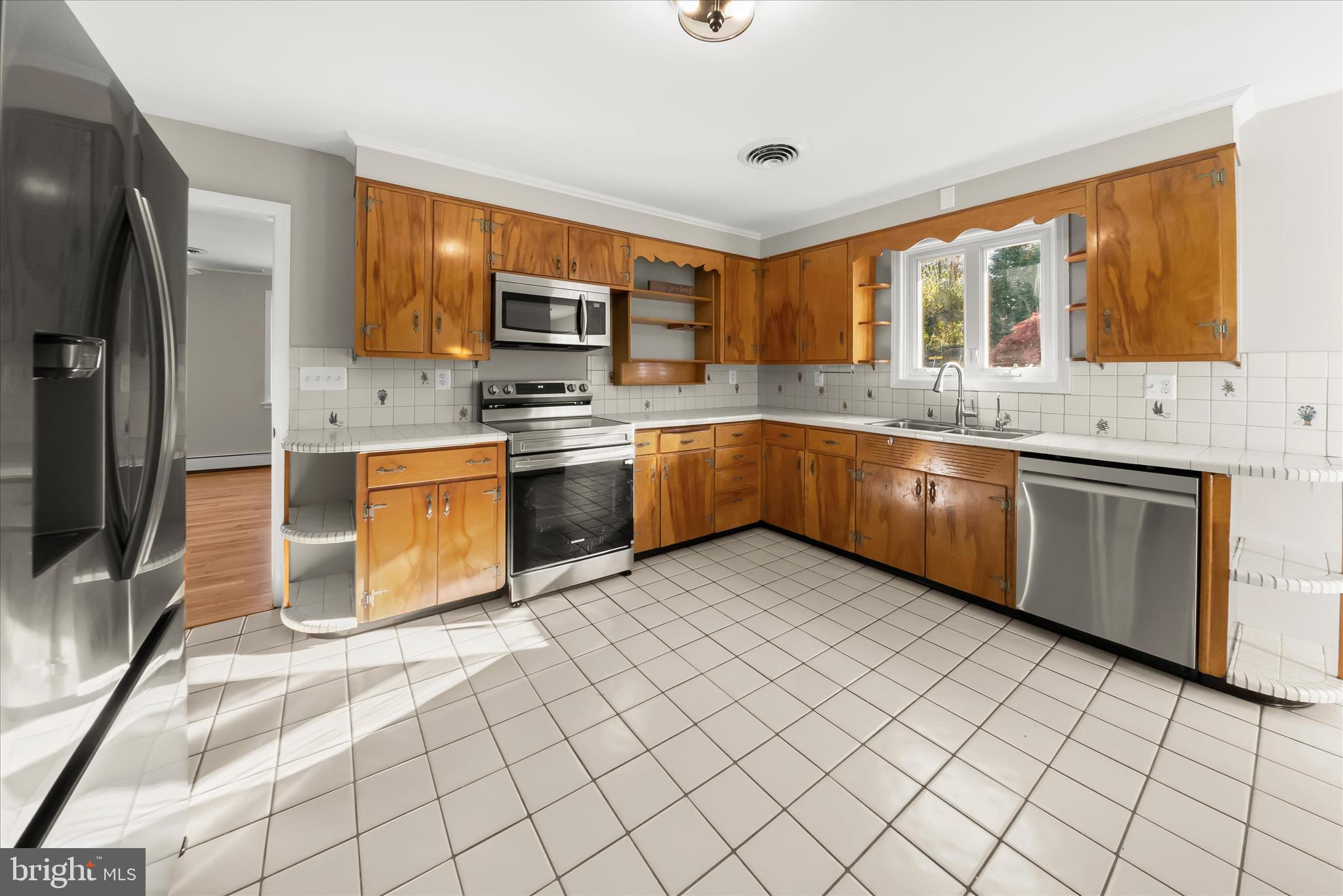 12775 Frederick Road West Friendship, MD 21794 - Photo 17 of 65 a large kitchen with stainless steel appliances granite countertop a stove sink and microwave