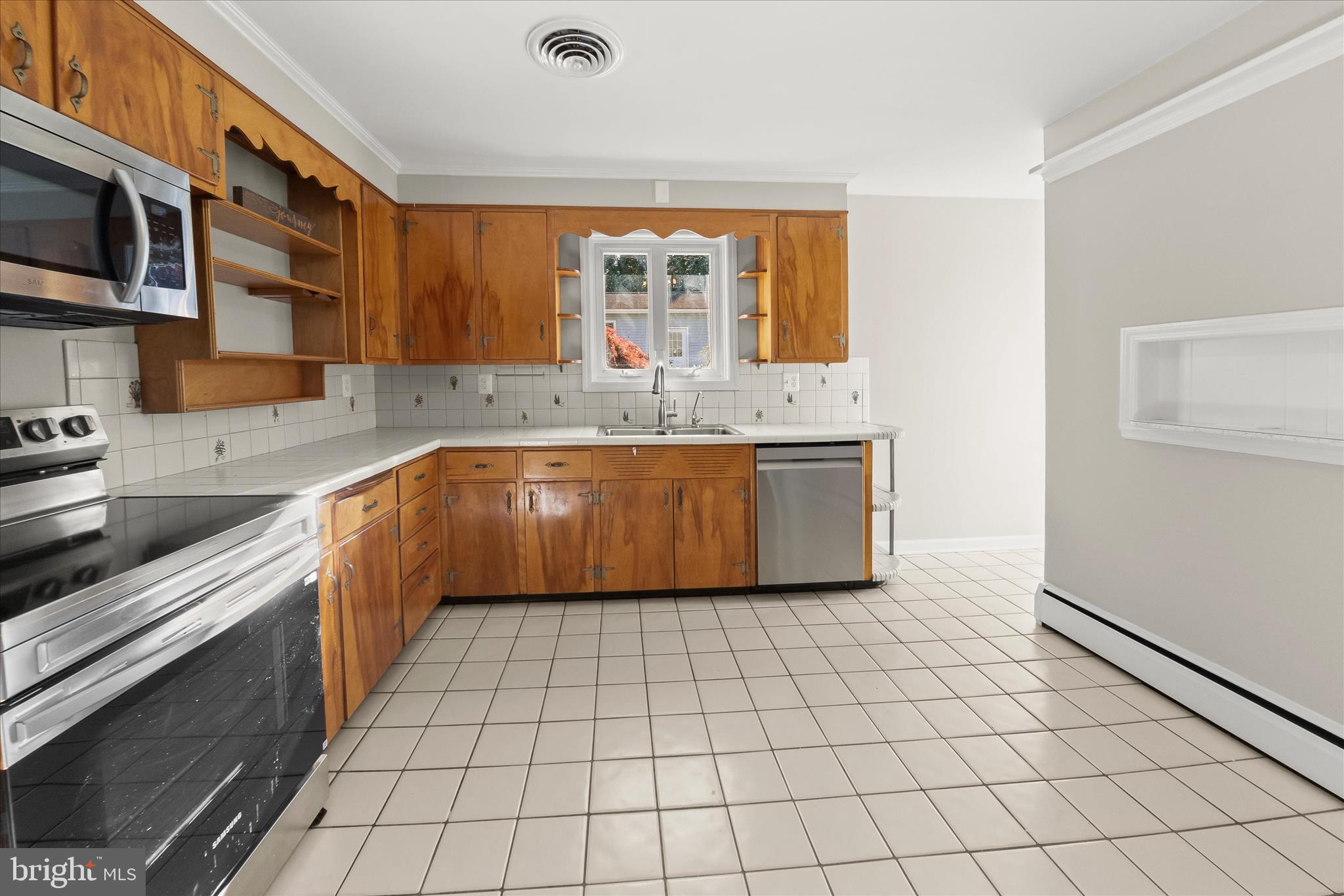 12775 Frederick Road West Friendship, MD 21794 - Photo 19 of 65 a kitchen with stainless steel appliances granite countertop a sink and a stove top oven with granite countertops