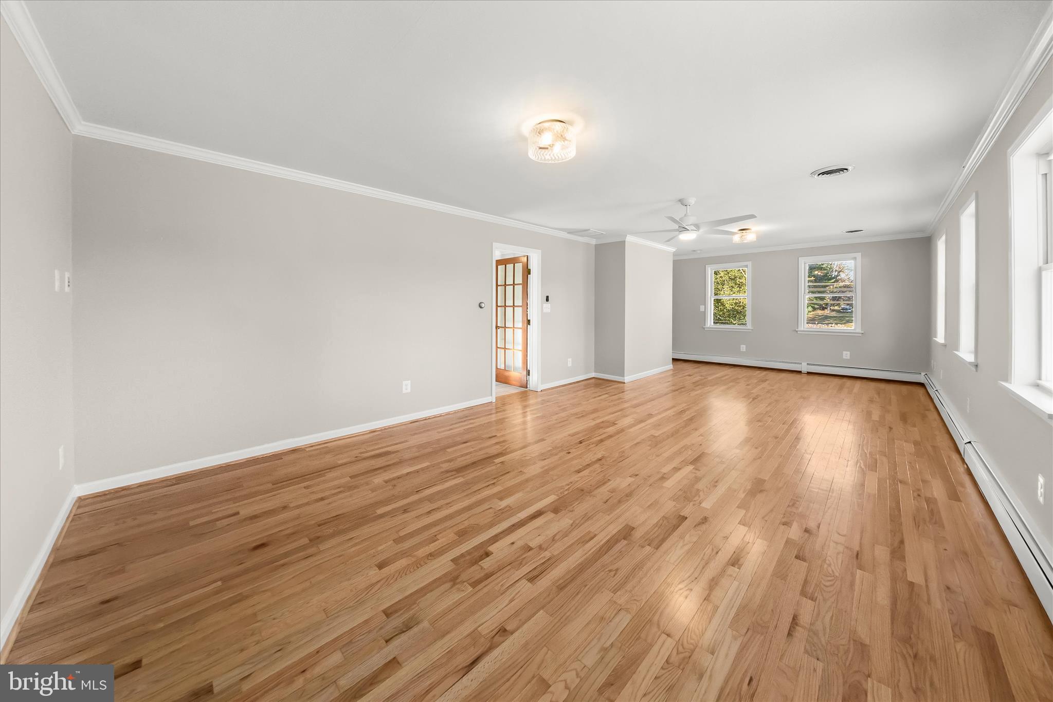 12775 Frederick Road West Friendship, MD 21794 - Photo 23 of 65 an empty room with wooden floor and windows