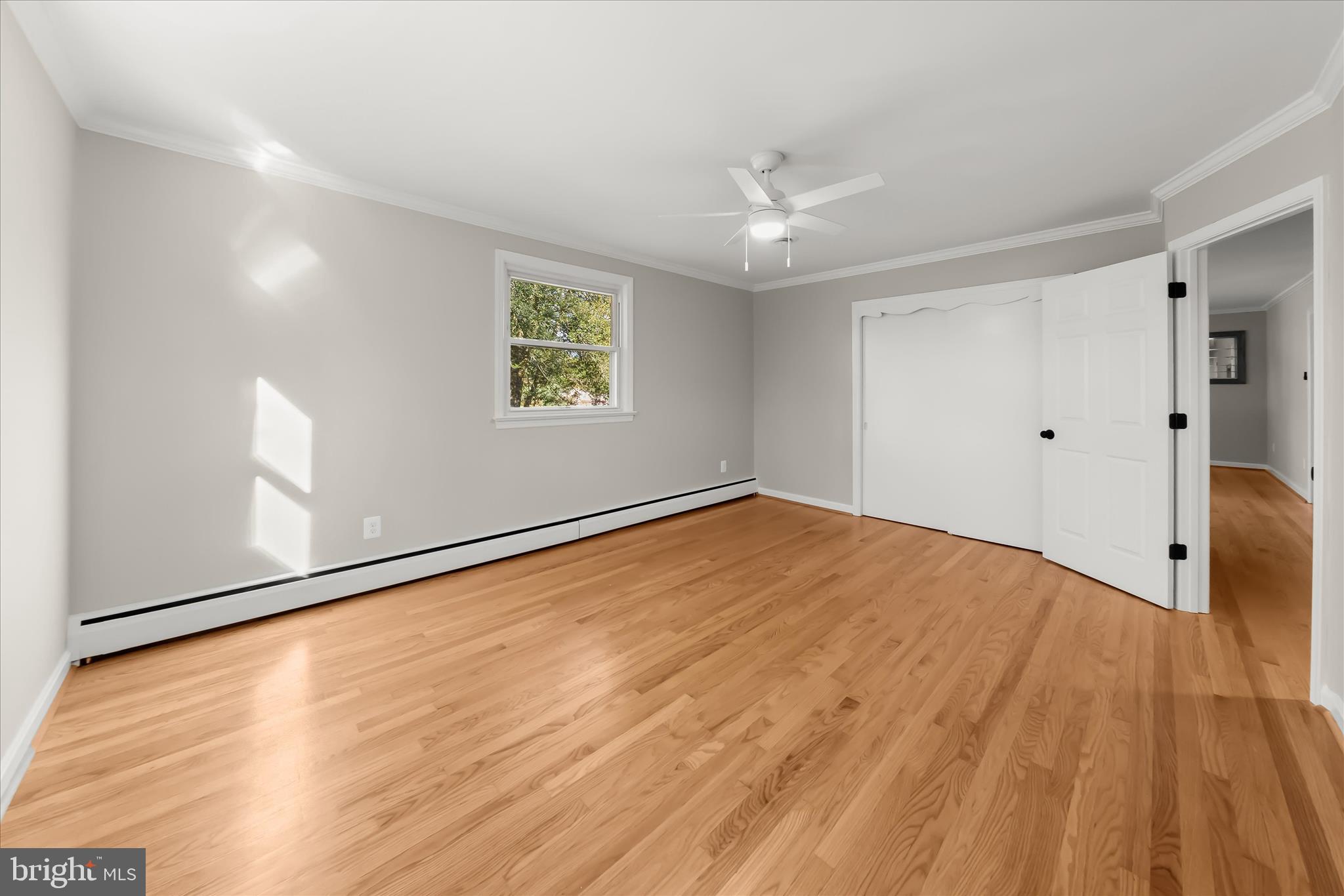 12775 Frederick Road West Friendship, MD 21794 - Photo 28 of 65 an empty room with wooden floor and windows