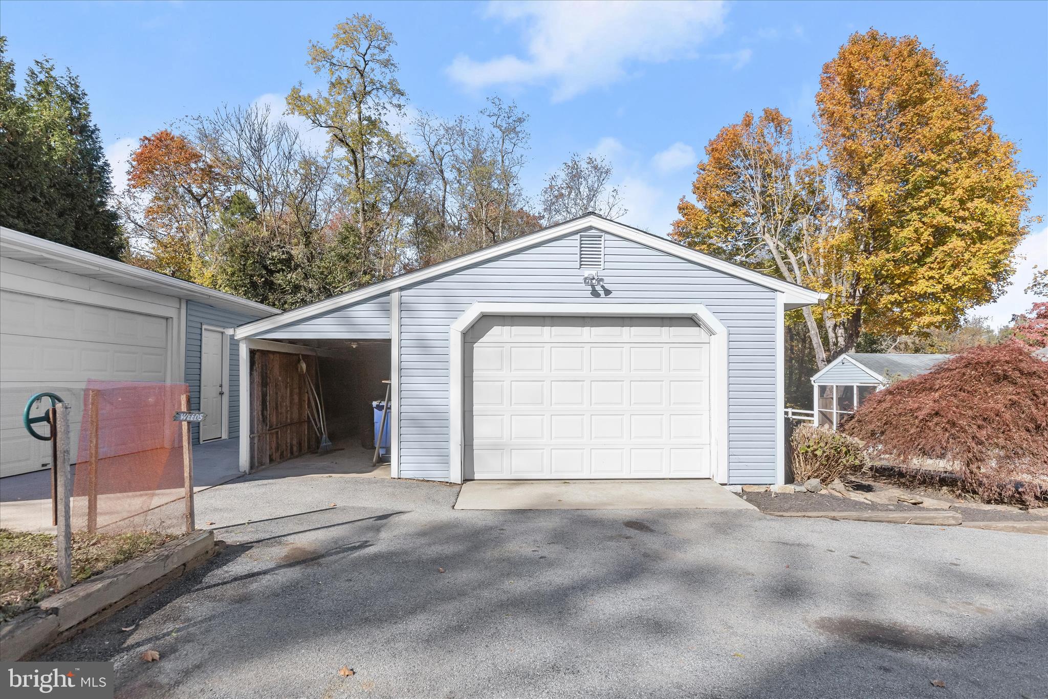12775 Frederick Road West Friendship, MD 21794 - Photo 49 of 65 a front view of a house with a yard and garage