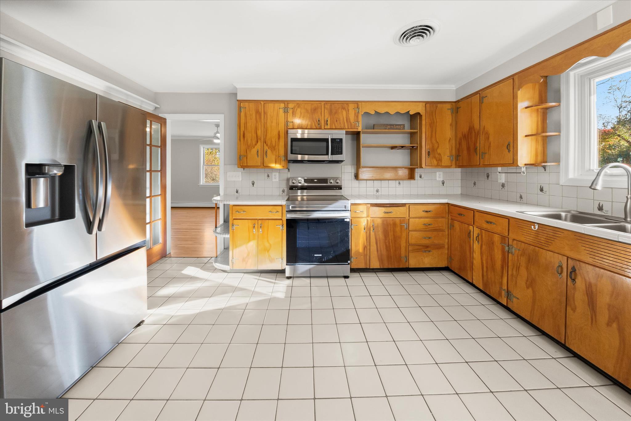 12775 Frederick Road West Friendship, MD 21794 - Photo 5 of 65 a large kitchen with stainless steel appliances granite countertop a stove sink and cabinets