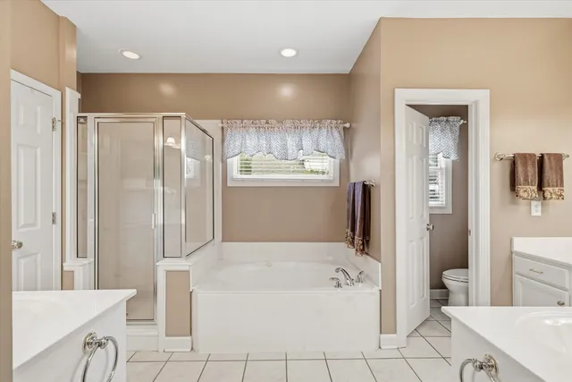 a bathroom with a bathtub and a sink