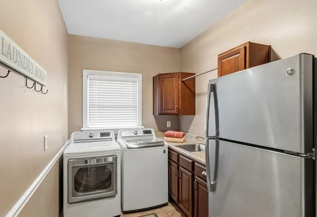 a utility room with dryer and washer