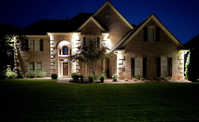 a front view of a house with a big yard
