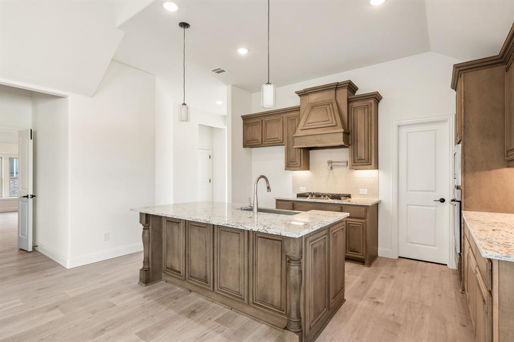 2016 Hickory Chase Lane Anna, TX 75409 - Photo 12 of 35 a kitchen with a sink stove and refrigerator