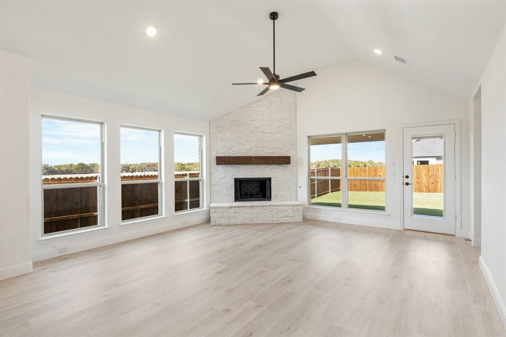 2016 Hickory Chase Lane Anna, TX 75409 - Photo 17 of 35 a view of an empty room with a fireplace and a window