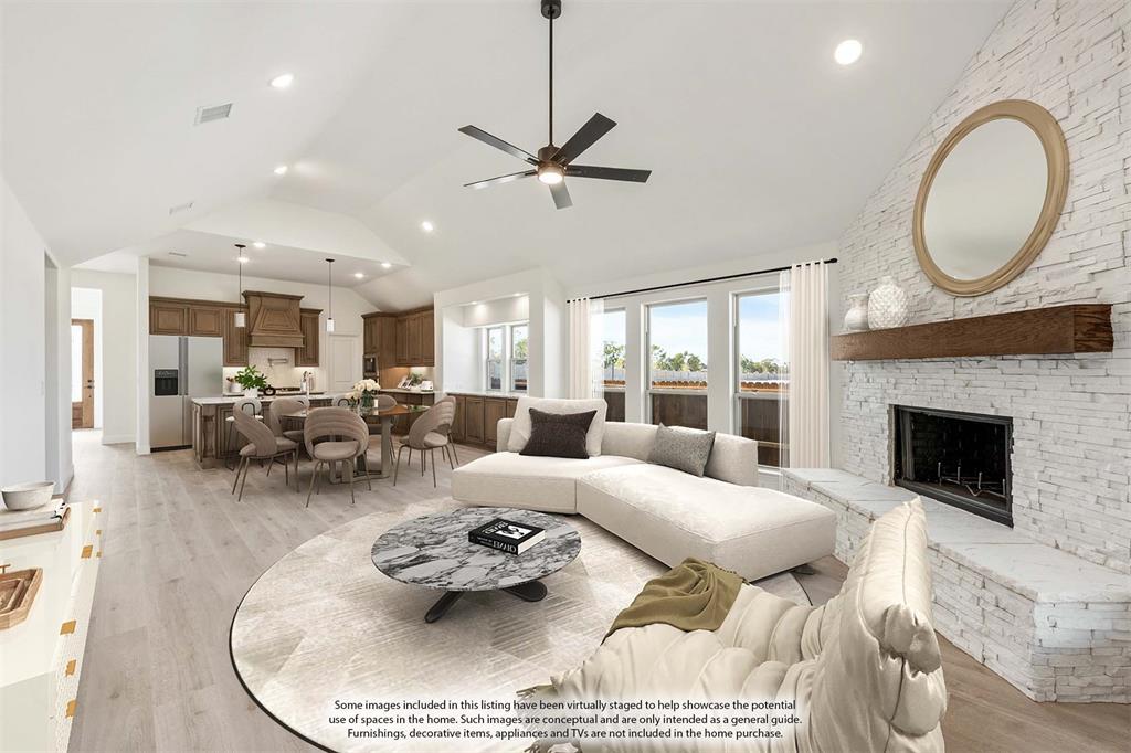 2016 Hickory Chase Lane Anna, TX 75409 - Photo 19 of 35 a living room with furniture a fireplace a rug and a large window