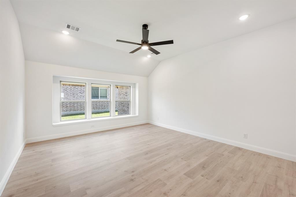 2016 Hickory Chase Lane Anna, TX 75409 - Photo 21 of 35 an empty room with a window and a ceiling fan