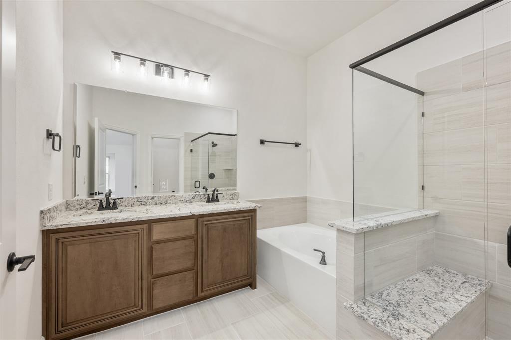 2016 Hickory Chase Lane Anna, TX 75409 - Photo 24 of 35 a spacious bathroom with a double vanity sink a mirror and a bathtub