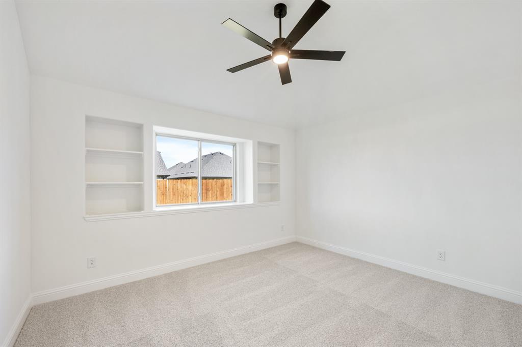 2016 Hickory Chase Lane Anna, TX 75409 - Photo 27 of 35 an empty room with a window and a ceiling fan