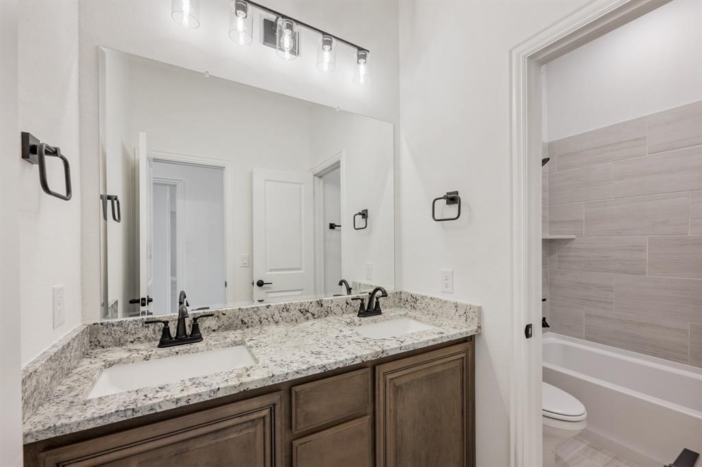 2016 Hickory Chase Lane Anna, TX 75409 - Photo 30 of 35 a bathroom with a granite countertop sink and a mirror