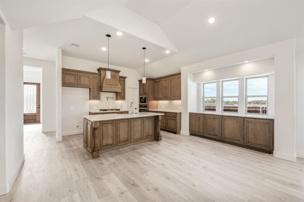 2016 Hickory Chase Lane Anna, TX 75409 - Photo 9 of 35 a large kitchen with a lot of counter space and stainless steel appliances