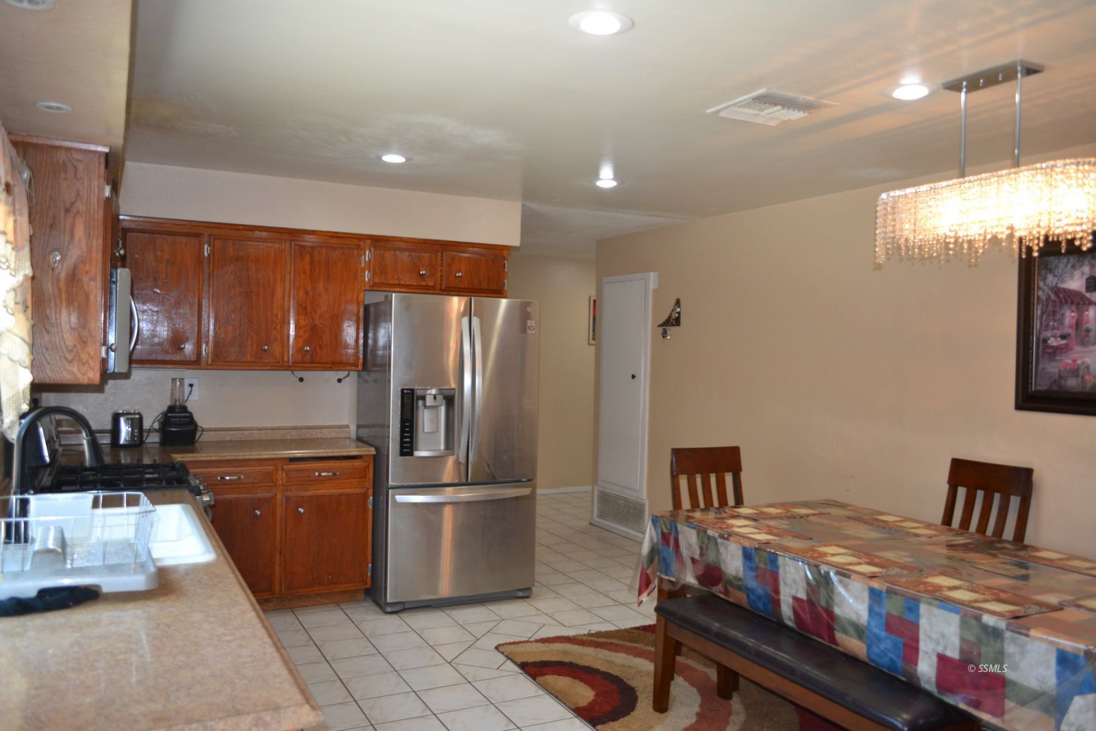 233 West St George Avenue Ridgecrest, CA 93555 - Photo 47 of 47 a kitchen with refrigerator and stove