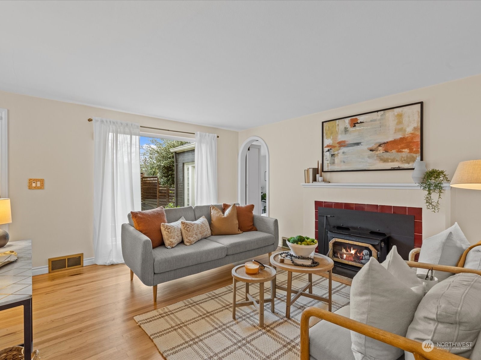 3735 Southwest 106th Street Seattle, WA 98146 - Photo 11 of 30 a living room with furniture and a fireplace