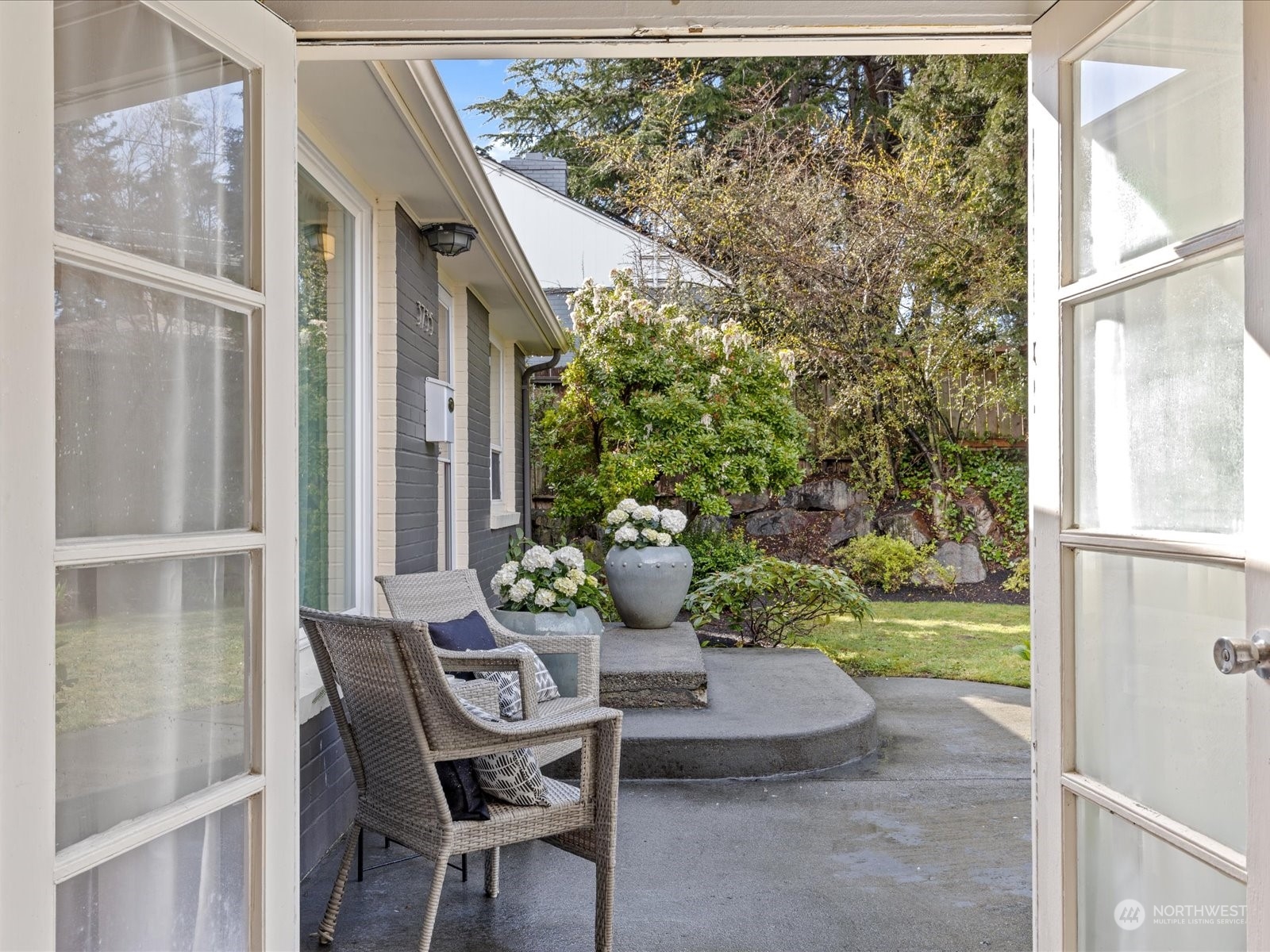 3735 Southwest 106th Street Seattle, WA 98146 - Photo 14 of 30 a view of a patio with table and chairs and potted plants