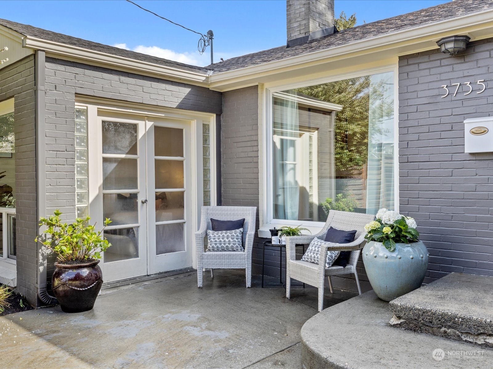 3735 Southwest 106th Street Seattle, WA 98146 - Photo 19 of 30 a view of a patio with chairs and a potted plant