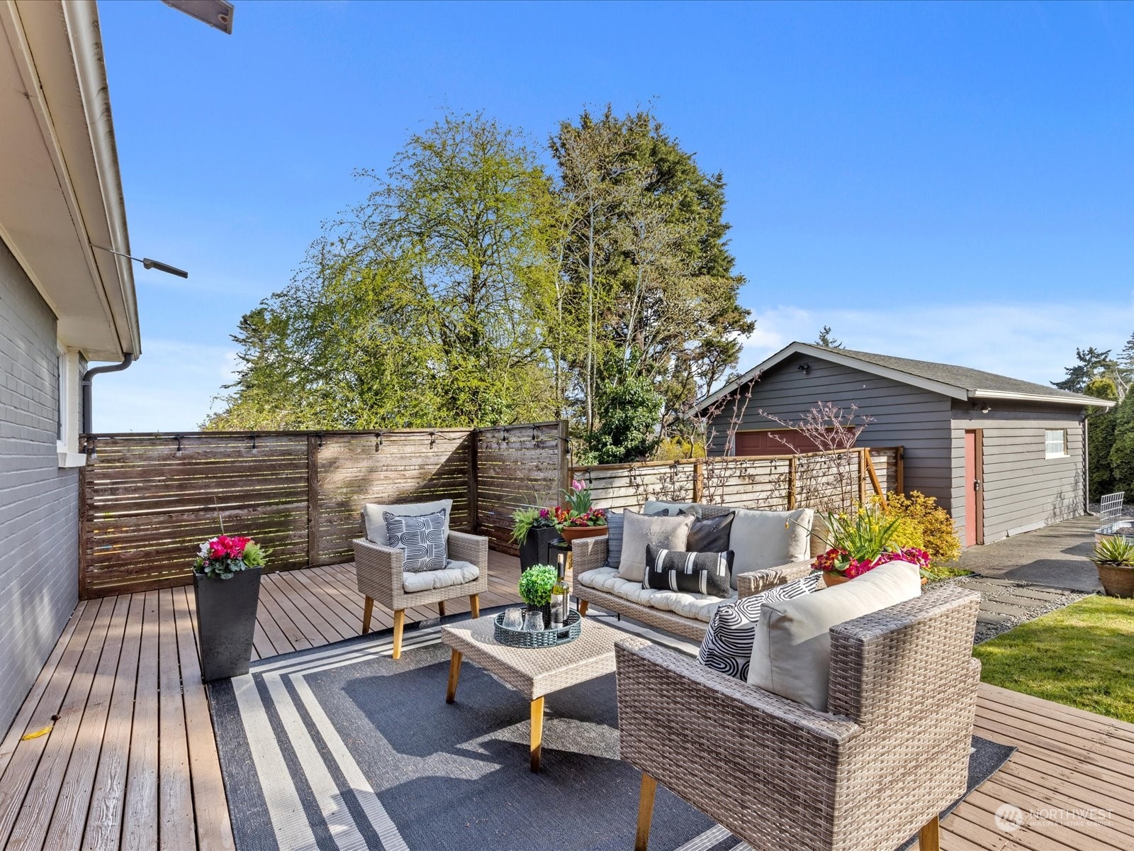 3735 Southwest 106th Street Seattle, WA 98146 - Photo 24 of 30 a view of a patio with couches and potted plants