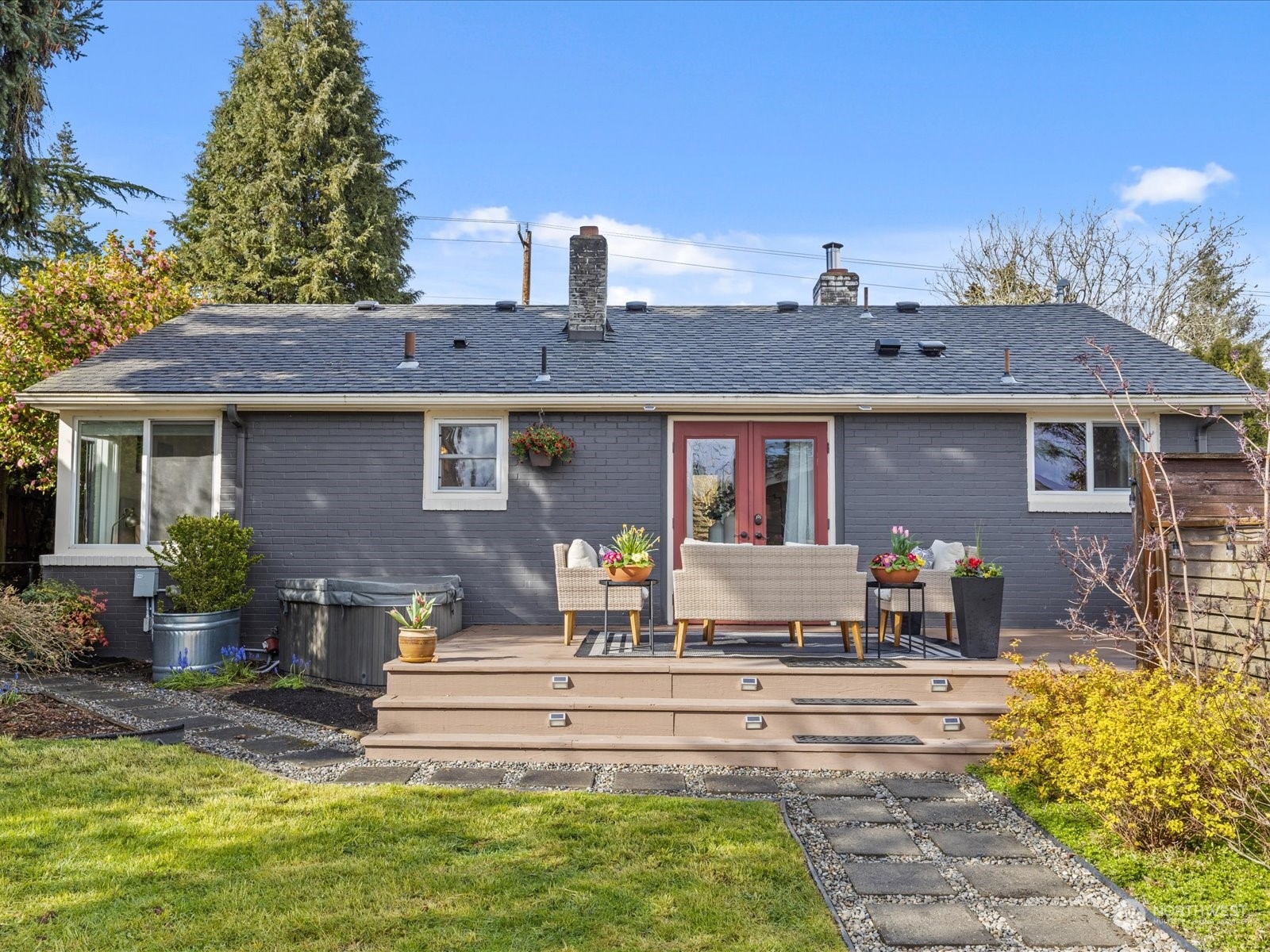 3735 Southwest 106th Street Seattle, WA 98146 - Photo 25 of 30 a front view of a house with swimming pool and sitting area