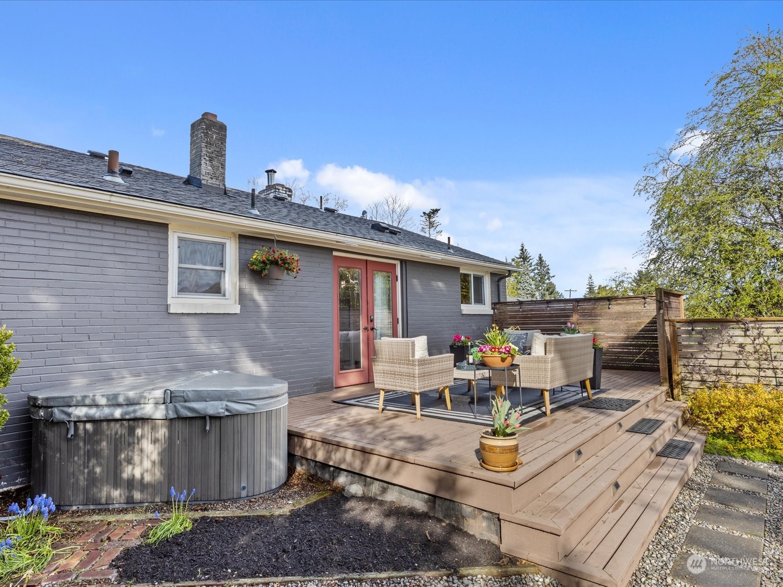 3735 Southwest 106th Street Seattle, WA 98146 - Photo 26 of 30 a view of a patio with table and chairs barbeque potted plants and large tree