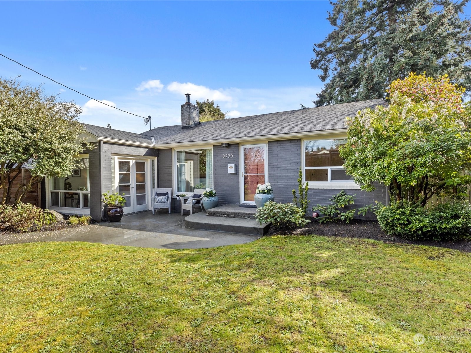 3735 Southwest 106th Street Seattle, WA 98146 - Photo 30 of 30 a view of a house with backyard and sitting area