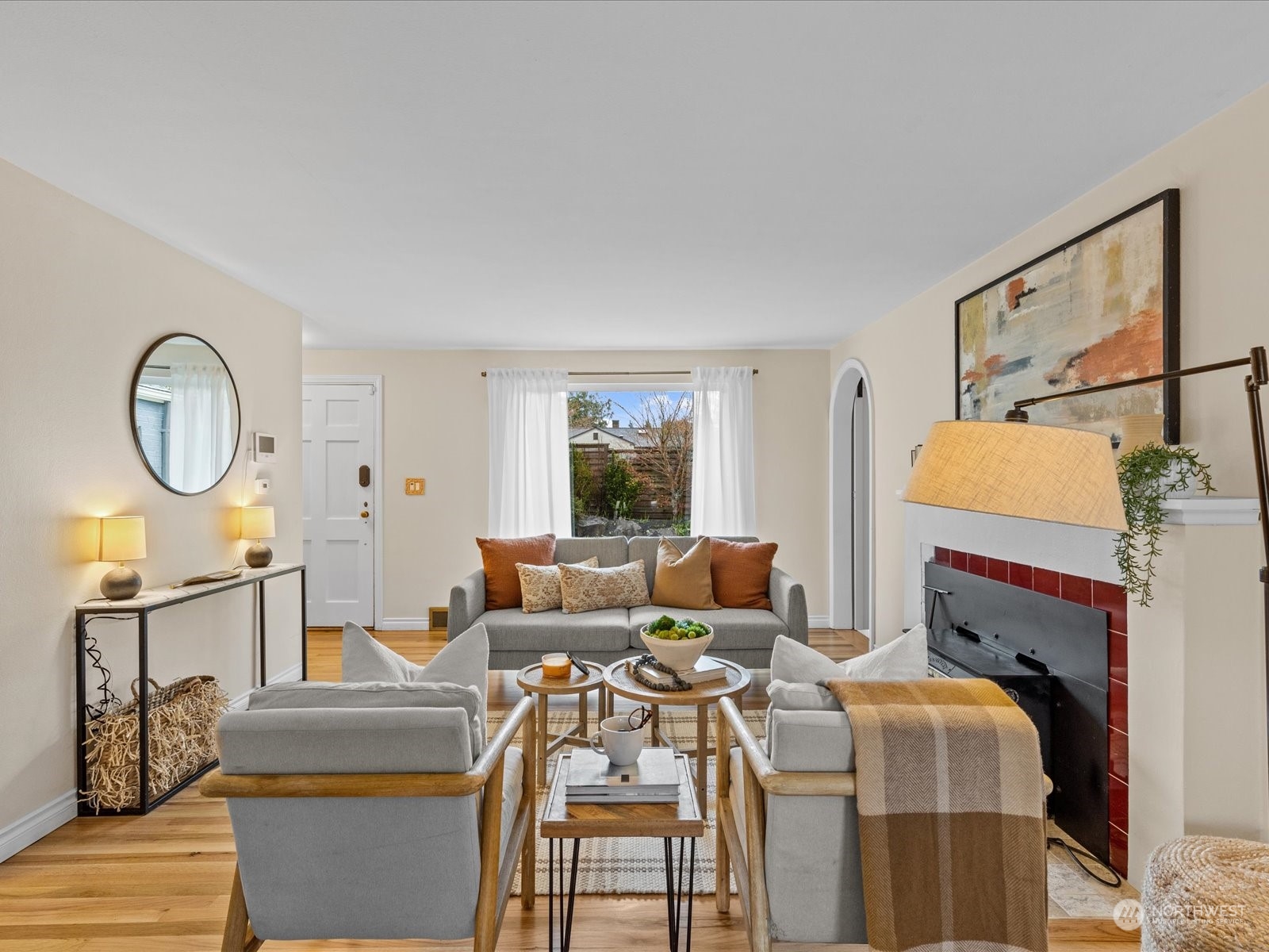 3735 Southwest 106th Street Seattle, WA 98146 - Photo 4 of 30 a living room with furniture a window and a fireplace