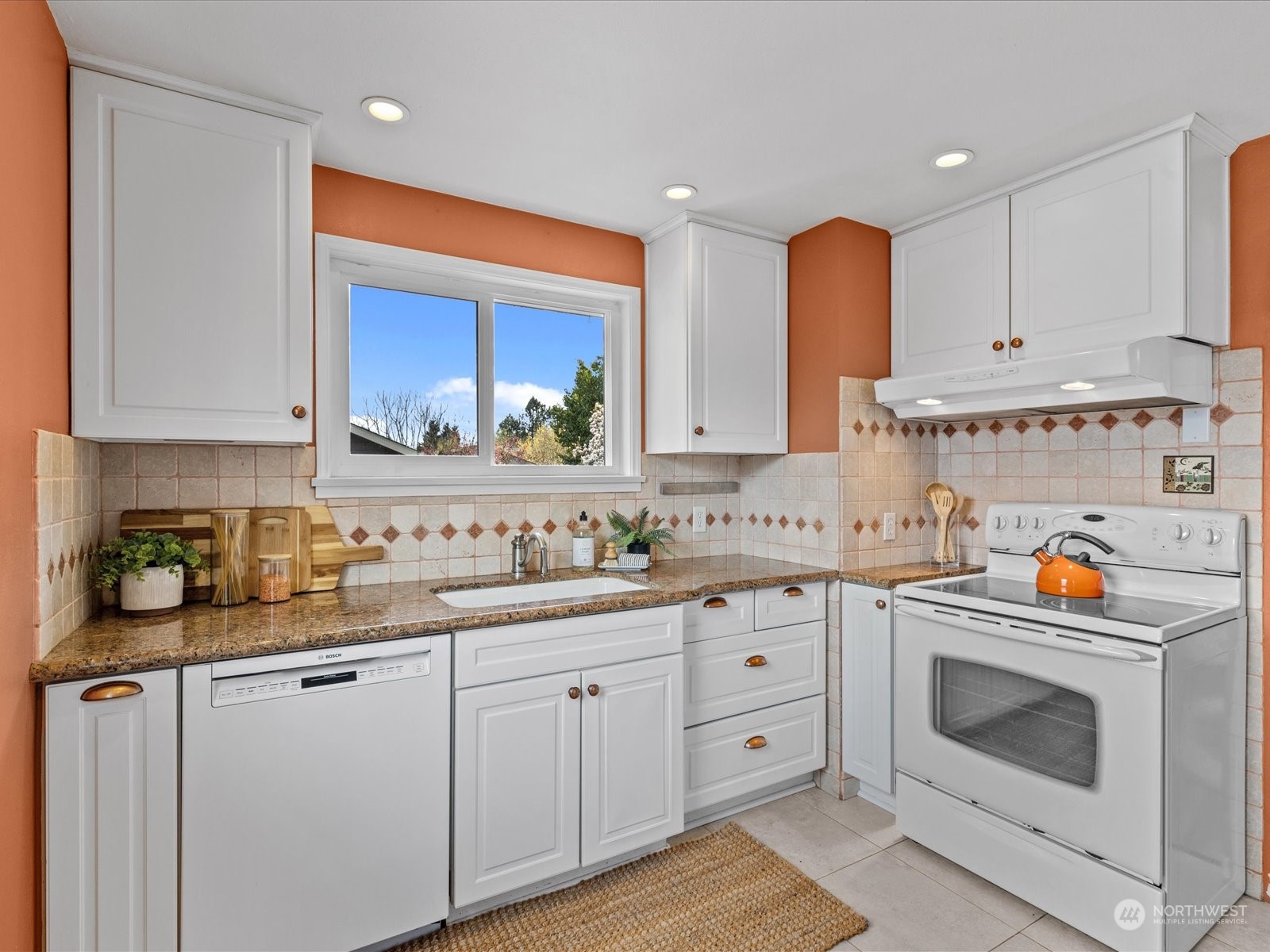 3735 Southwest 106th Street Seattle, WA 98146 - Photo 7 of 30 a kitchen with a white cabinets and window