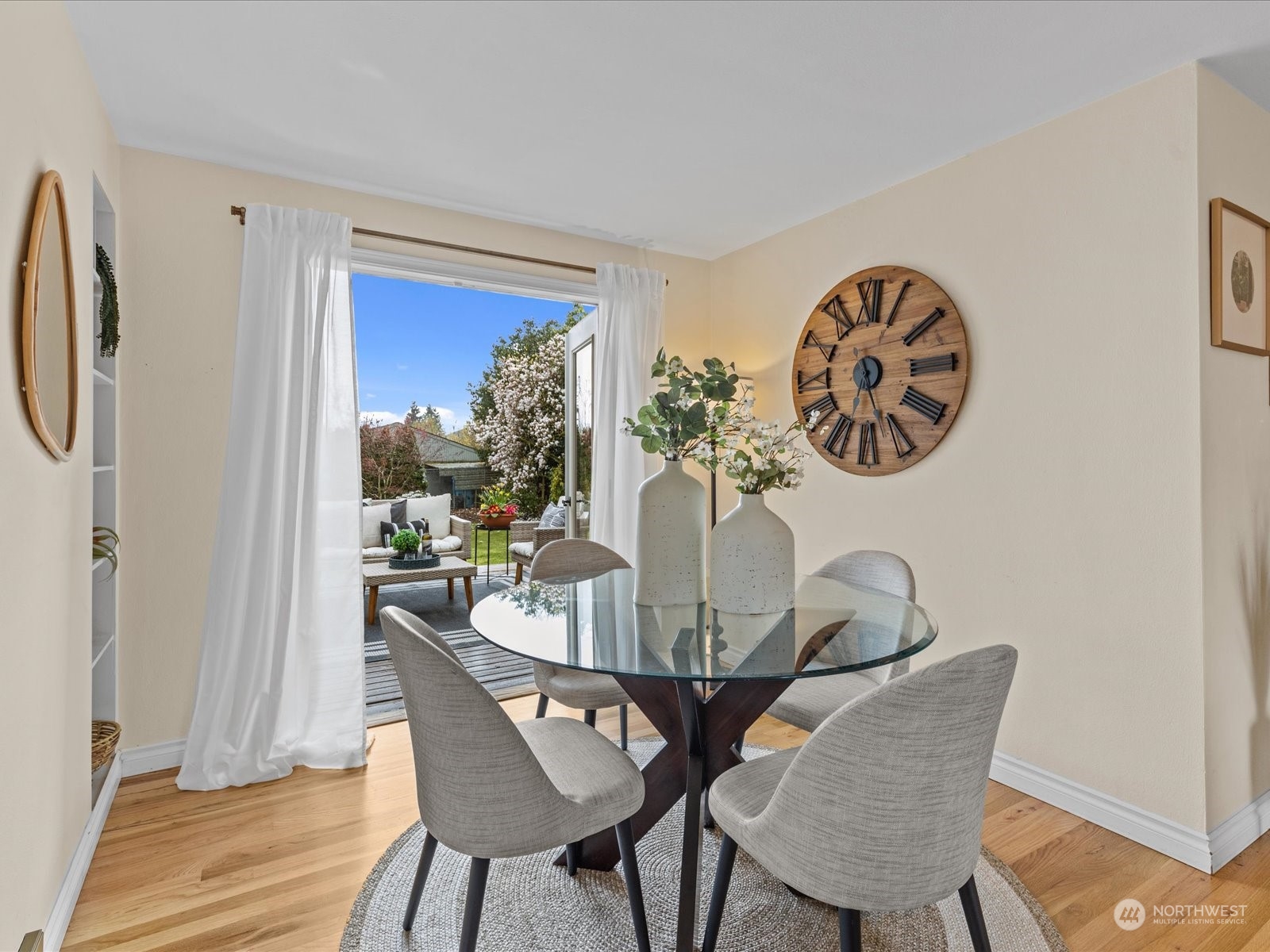 3735 Southwest 106th Street Seattle, WA 98146 - Photo 9 of 30 a view of a dining room with furniture window and wooden floor