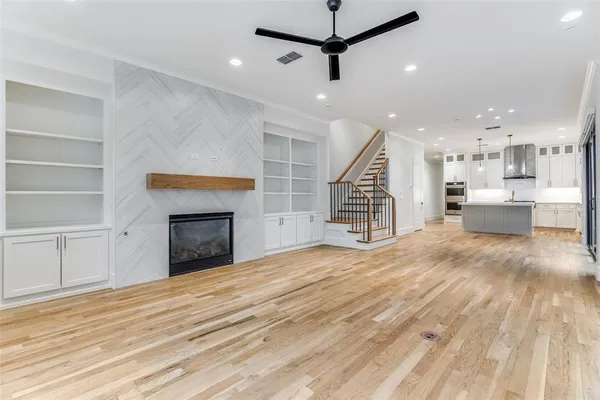 a view of a livingroom with a fireplace and workspace