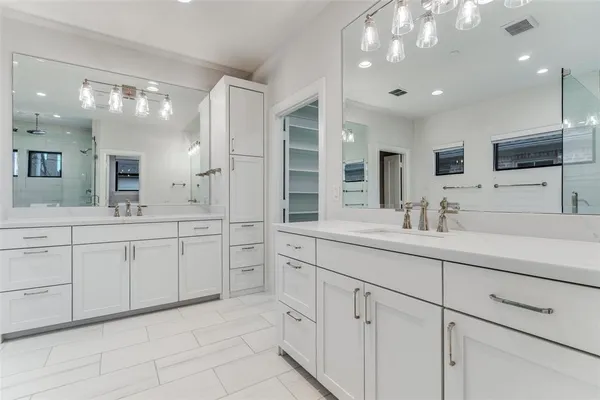 a bathroom with a sink vanity and mirror