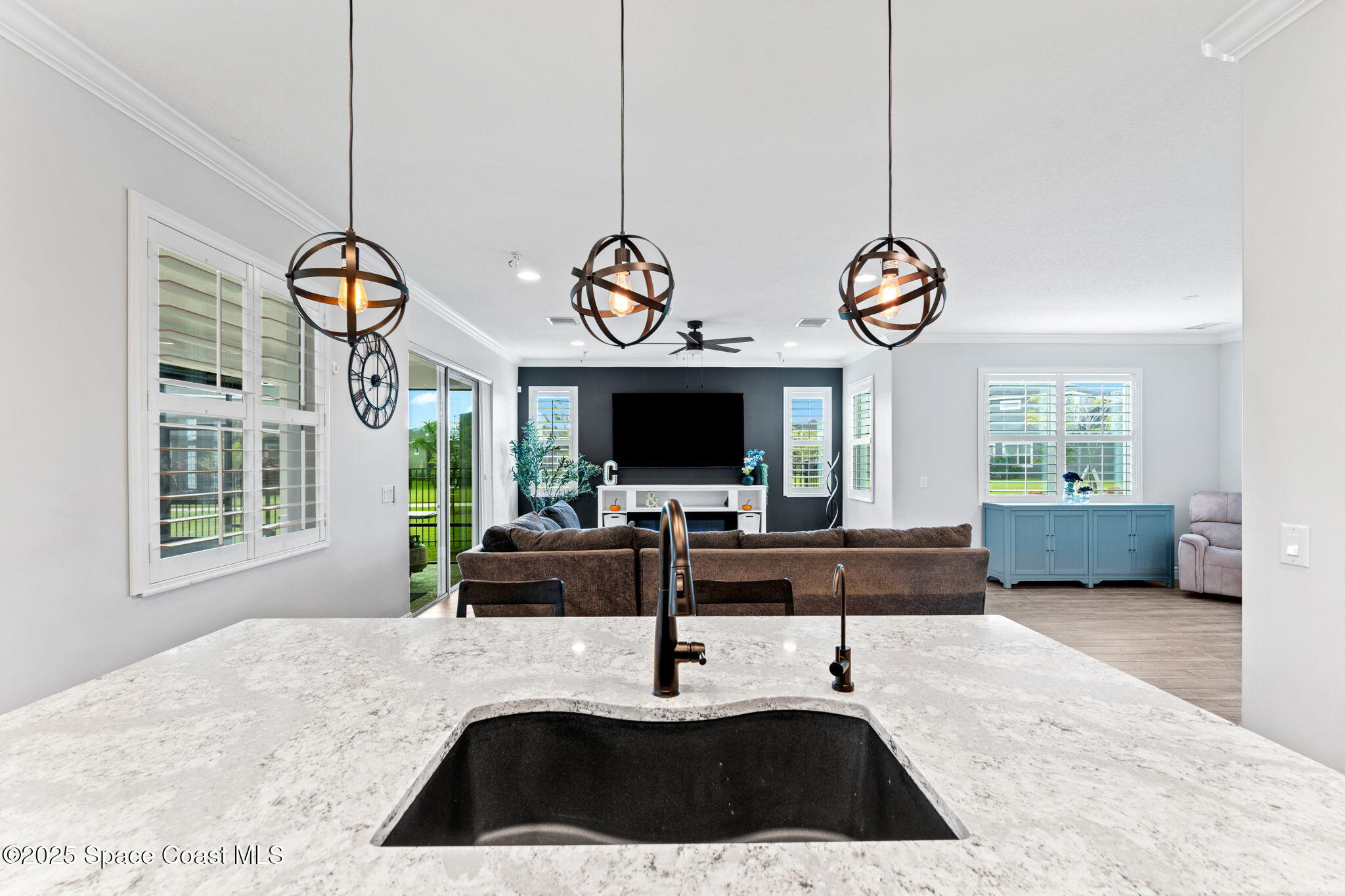 8215 Millbrook Avenue Melbourne, FL 32940 - Photo 19 of 62 a living room with couch and a flat screen tv