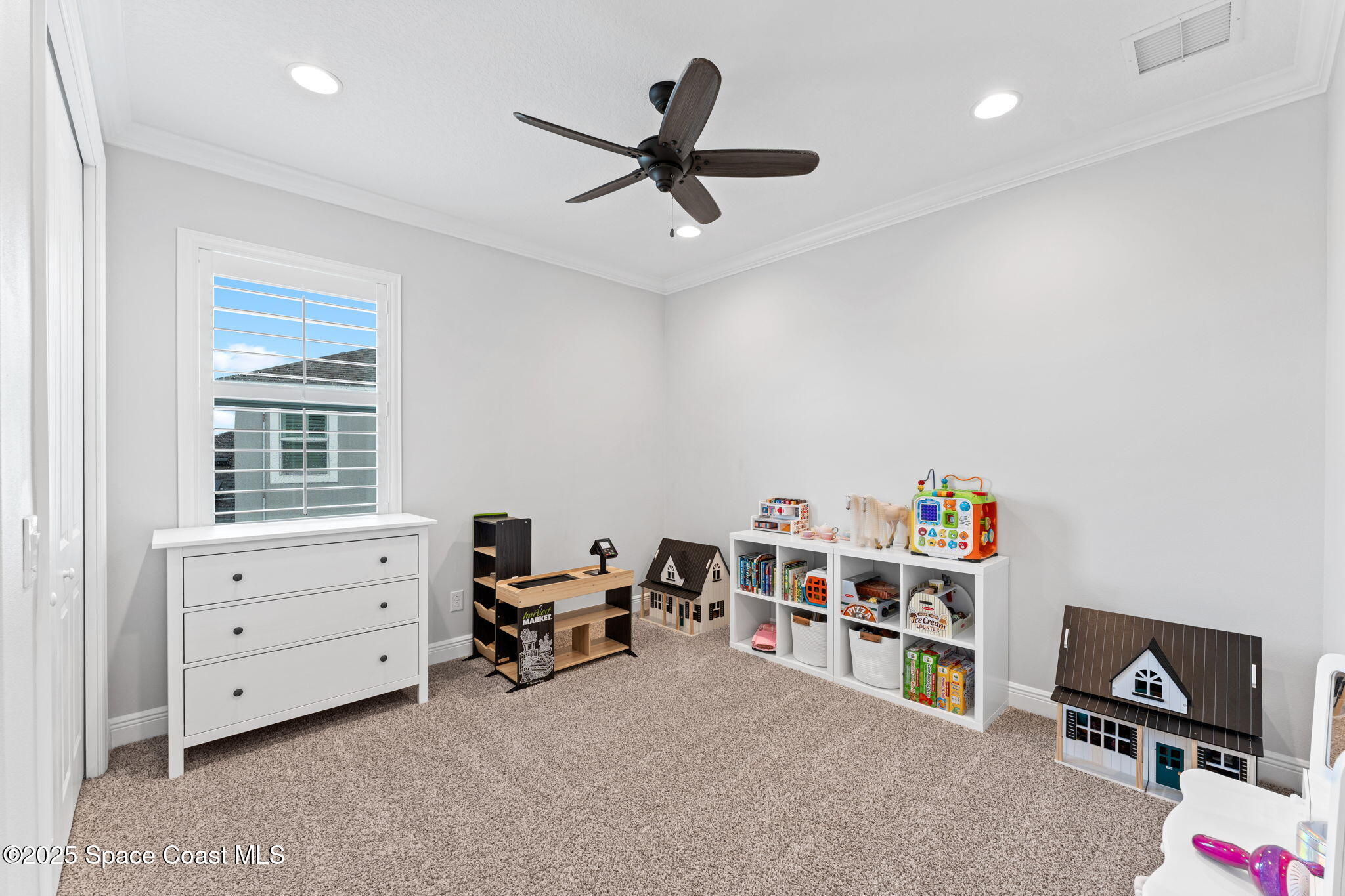 8215 Millbrook Avenue Melbourne, FL 32940 - Photo 32 of 62 a room with furniture and a window