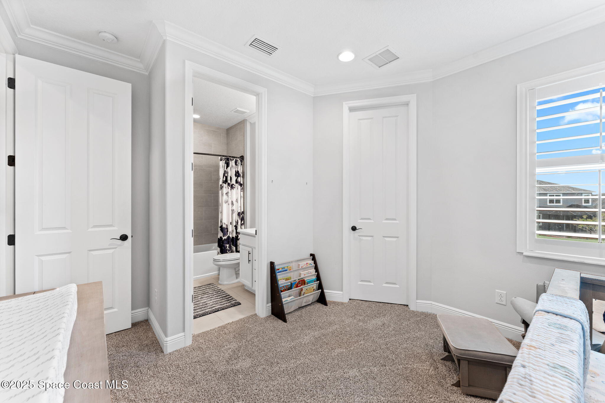 8215 Millbrook Avenue Melbourne, FL 32940 - Photo 35 of 62 a view of a livingroom with furniture and a window