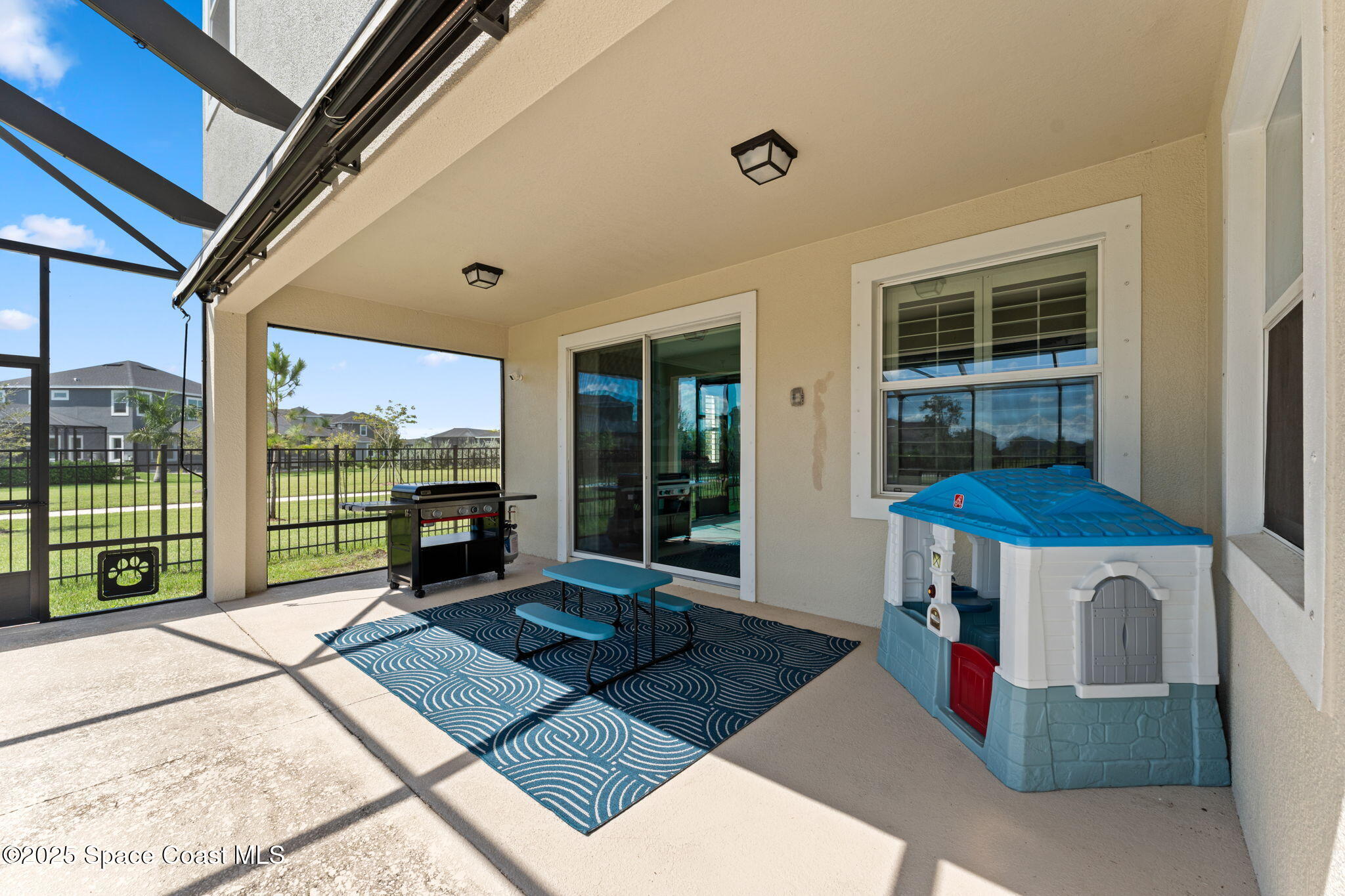 8215 Millbrook Avenue Melbourne, FL 32940 - Photo 37 of 62 a view of a room with furniture and a fireplace