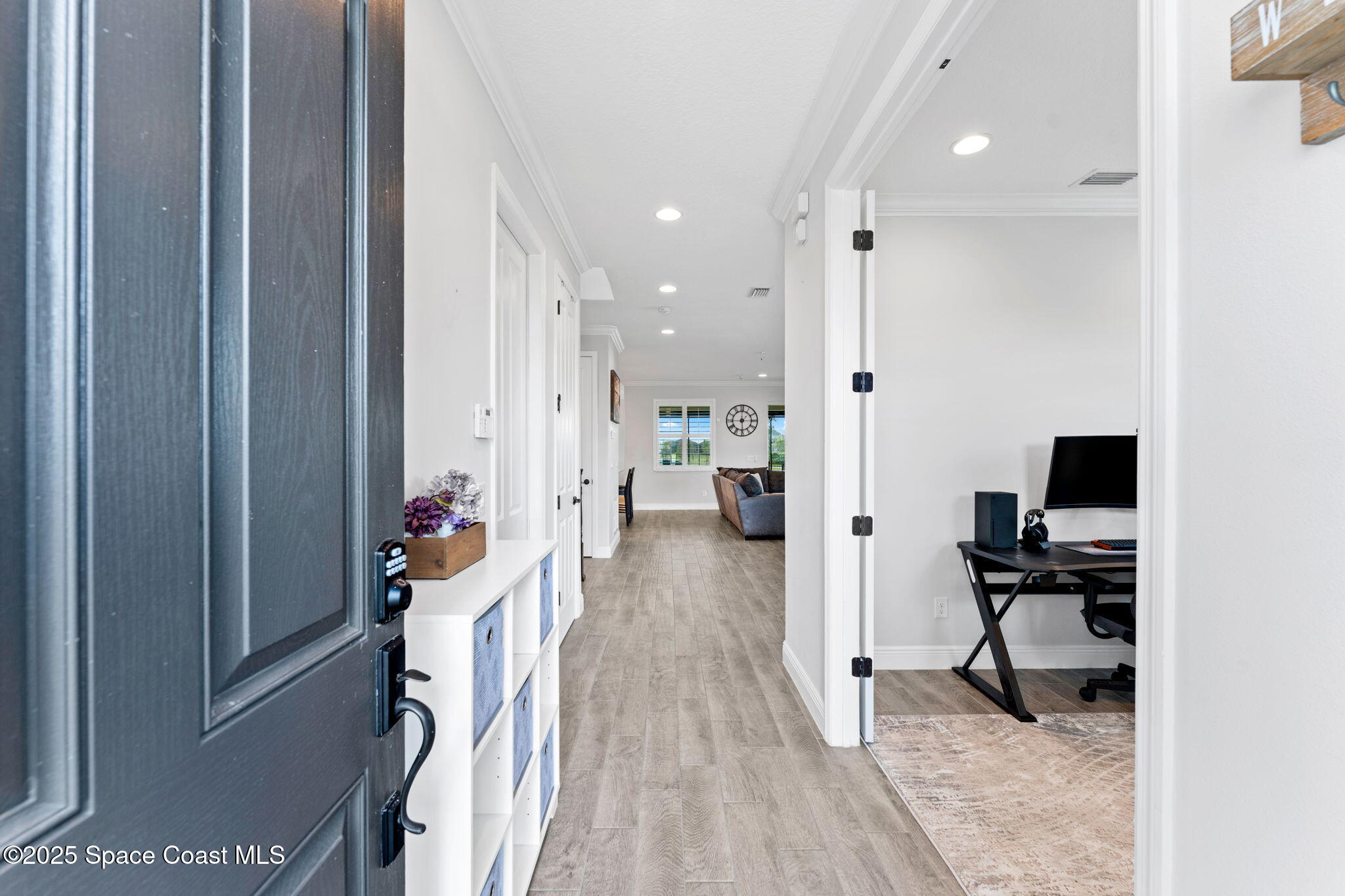 8215 Millbrook Avenue Melbourne, FL 32940 - Photo 3 of 62 a view of a living room