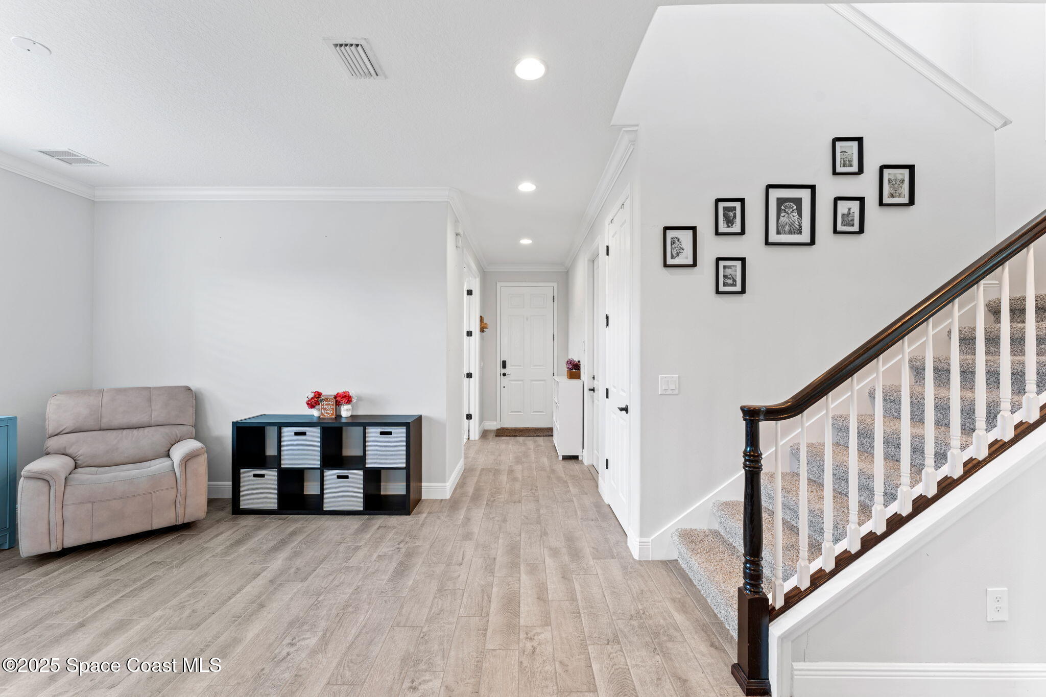 8215 Millbrook Avenue Melbourne, FL 32940 - Photo 4 of 62 a view of livingroom with furniture and stairs