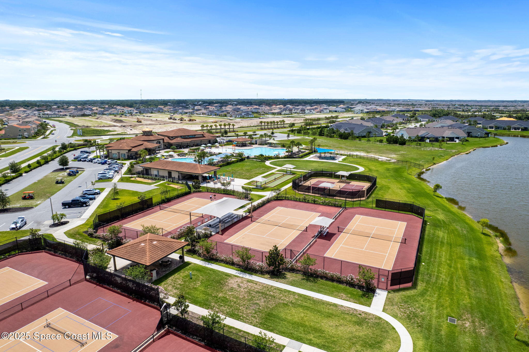 8215 Millbrook Avenue Melbourne, FL 32940 - Photo 56 of 62 an aerial view of residential houses with outdoor space