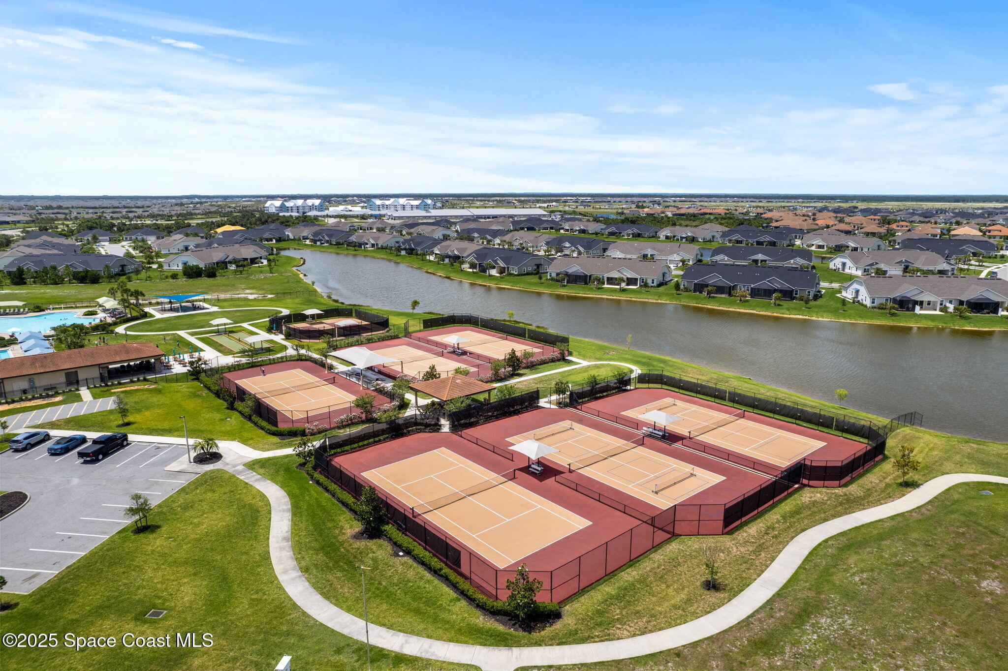 8215 Millbrook Avenue Melbourne, FL 32940 - Photo 58 of 62 an aerial view of a house with outdoor space lake view in back