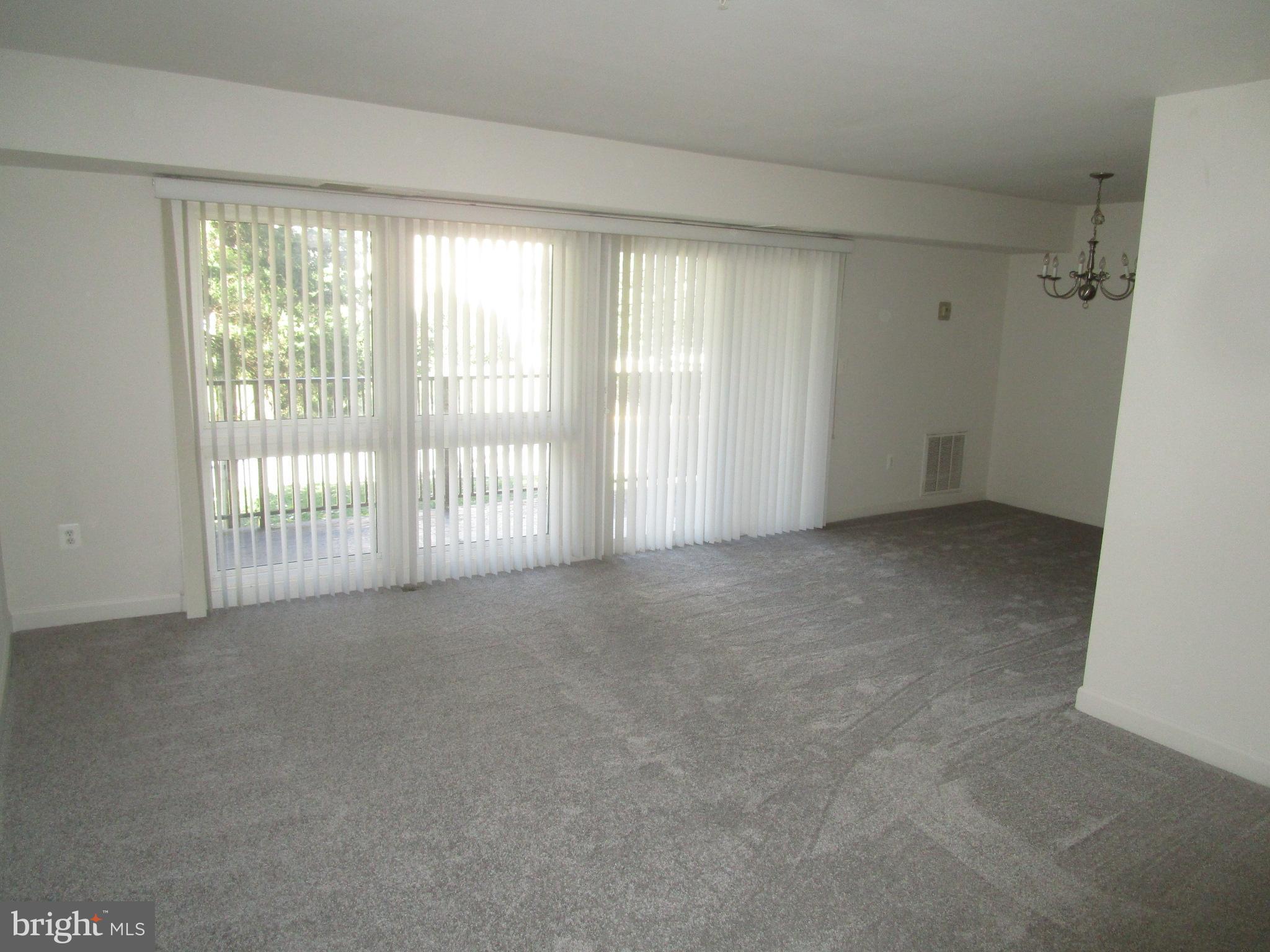 3126 Brinkley Road, Unit 201 Temple Hills, MD 20748 - Photo 2 of 7 Large Living / Dining Area New W/W carpets