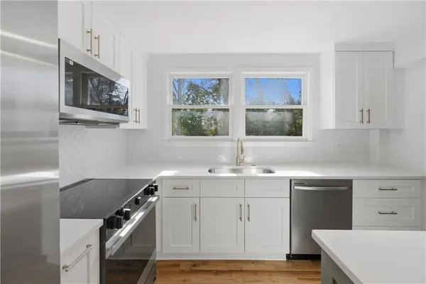 a view of balcony with wooden floor and fence