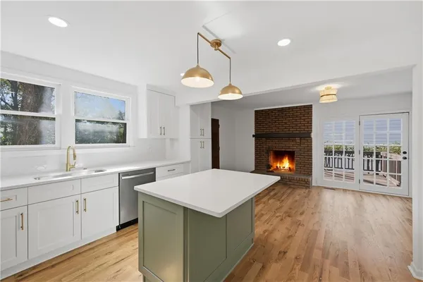 a view of a house with a wooden fence